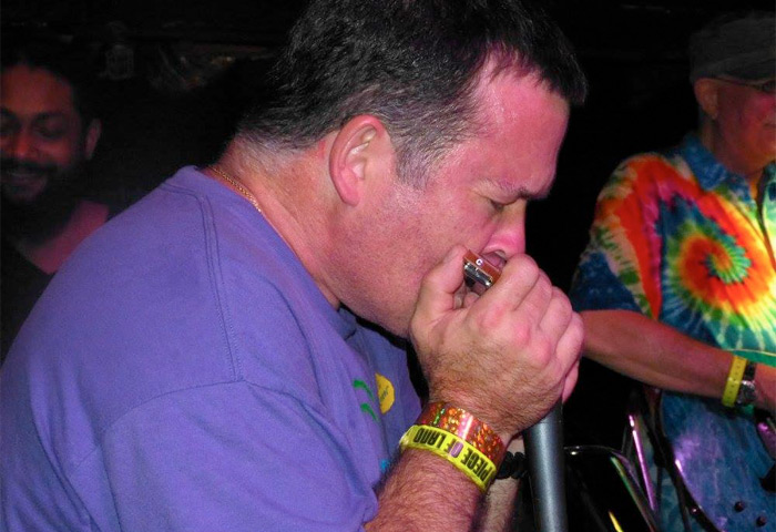 Scott Nickerson playing the harmonica